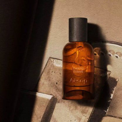 Aesop Evoking Eidesis bottle on stacked mirrored trays.