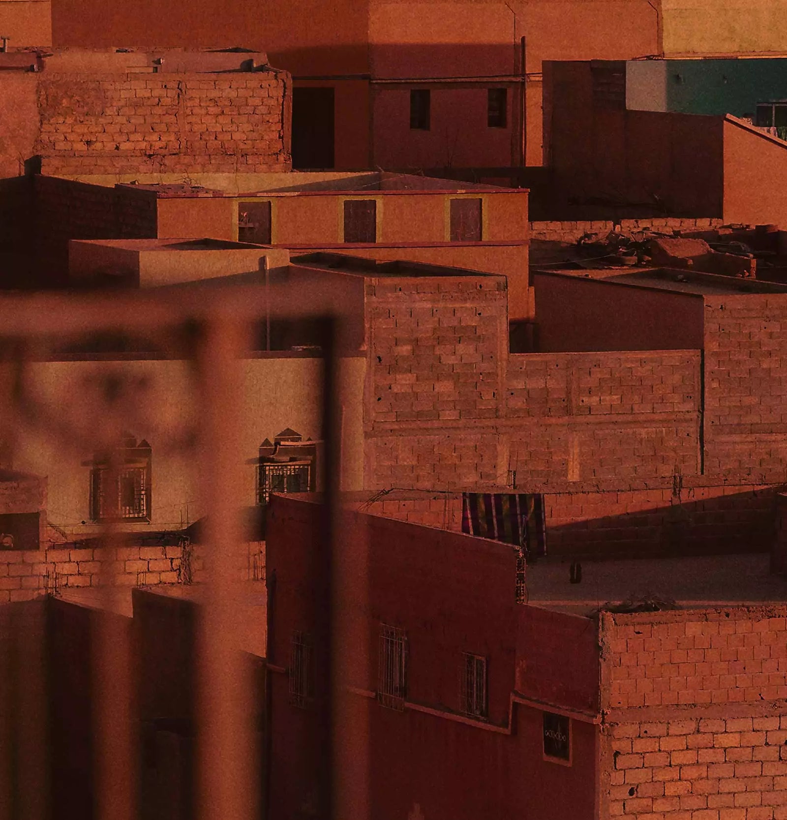 Close-up of a warm architectural facade with terracotta tones.